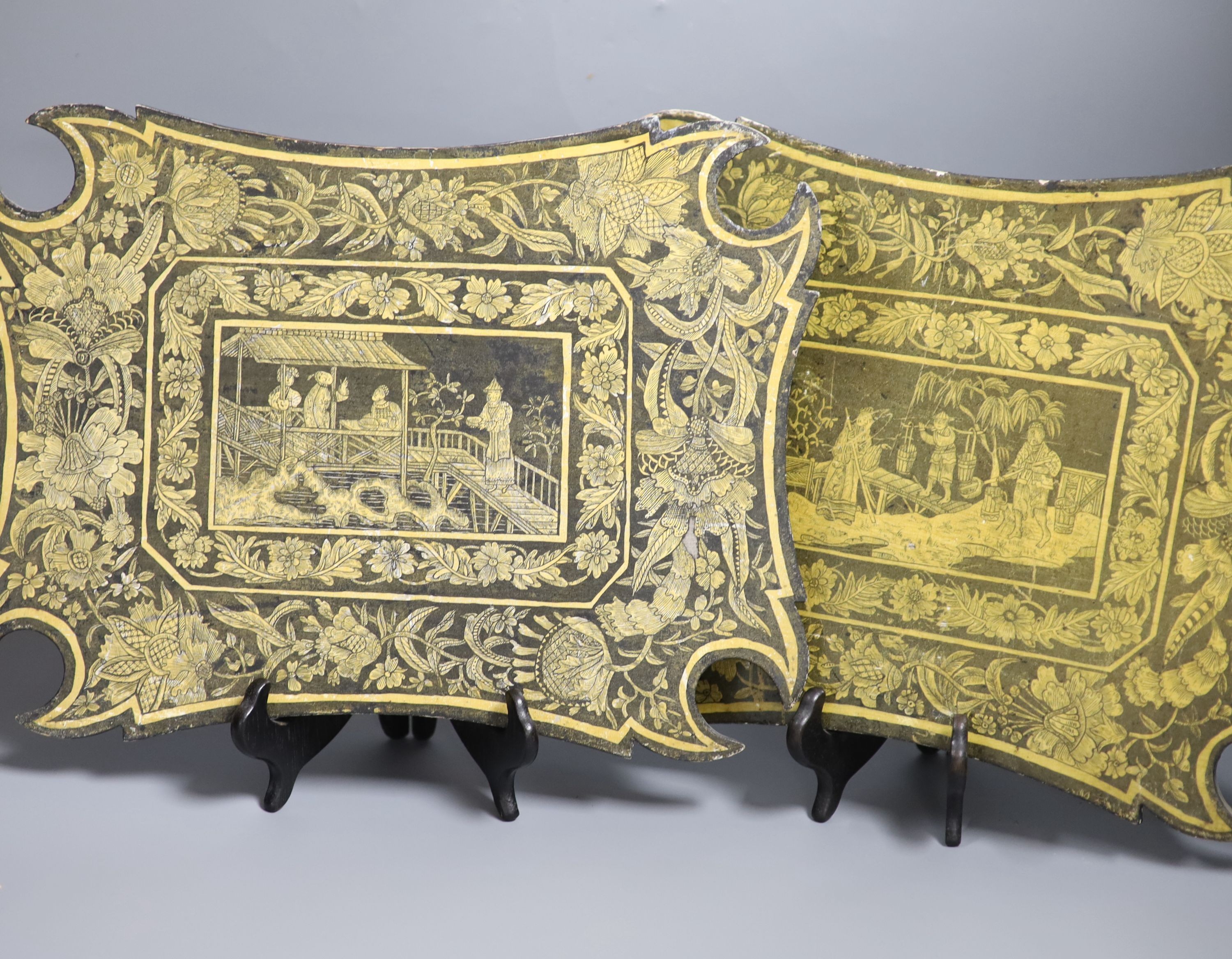 A pair of Regency chinoiserie papier mache face screens, height 27cm width 36cm, with pole screen fittings to the back